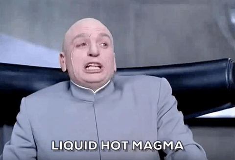 Dr. Evil sitting at a table in his underground lair and overly enunciating 'Liquid hot magma'.
